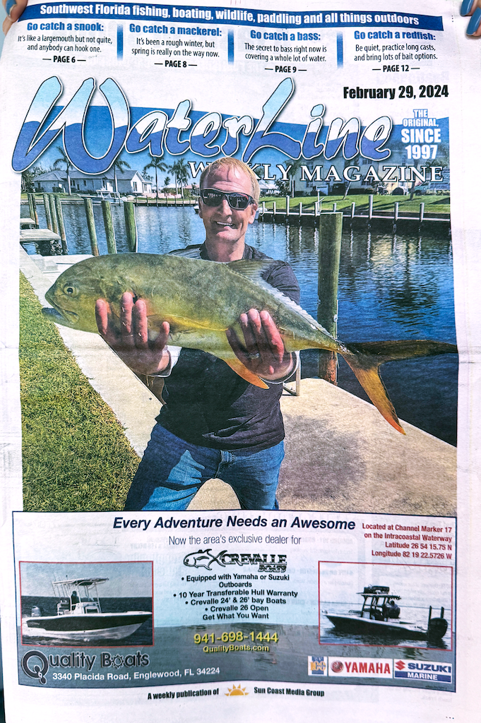 Me holding up trophy fish on cover of Waterline Magazine.